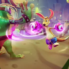 Kao, kangur z magicznymi rękawicami, walczy z dwoma zielonymi żabami w fantastycznym świecie.