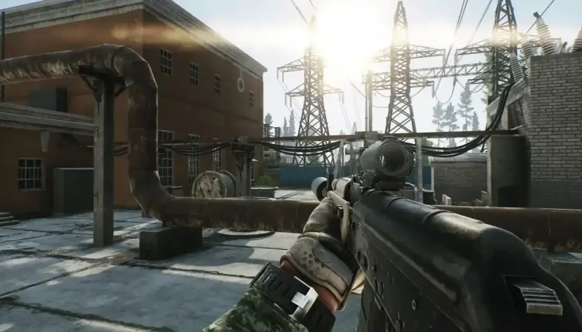 Gracz celuje z karabinu w pobliżu stacji energetycznej, przygotowując się na nowy tarkov wipe.