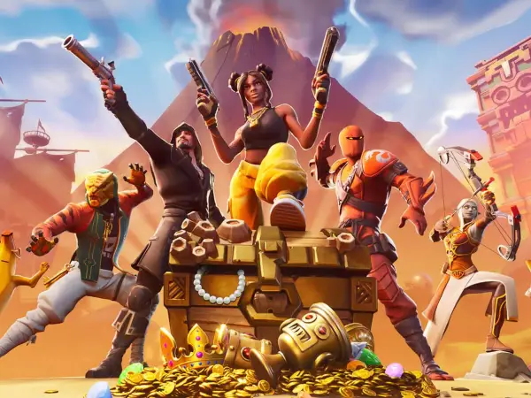 Postacie z gry Fortnite przy skrzyni pełnej skarbów. Idealne dla graczy szukających darmowe gry na PS4.